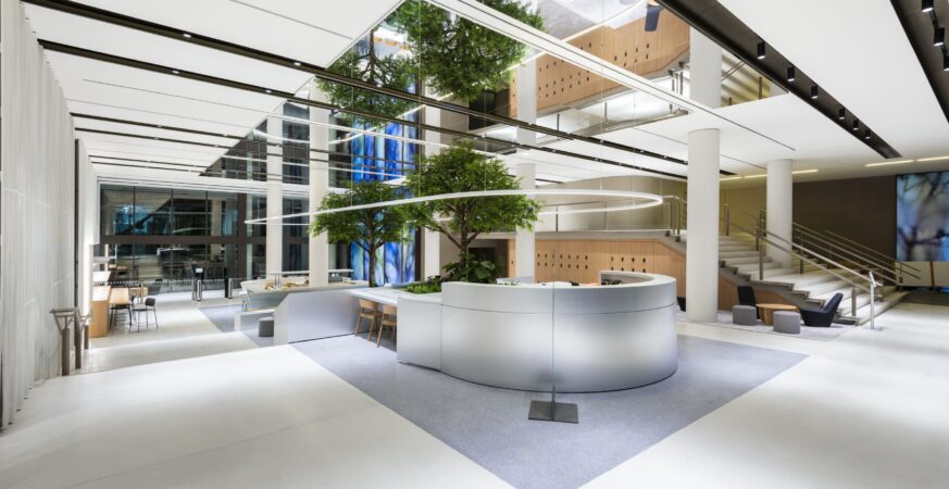 Information technology professionals working together in a modern UK office.