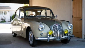 Classic collector car stored securely in a UK garage for specialist insurance coverage.