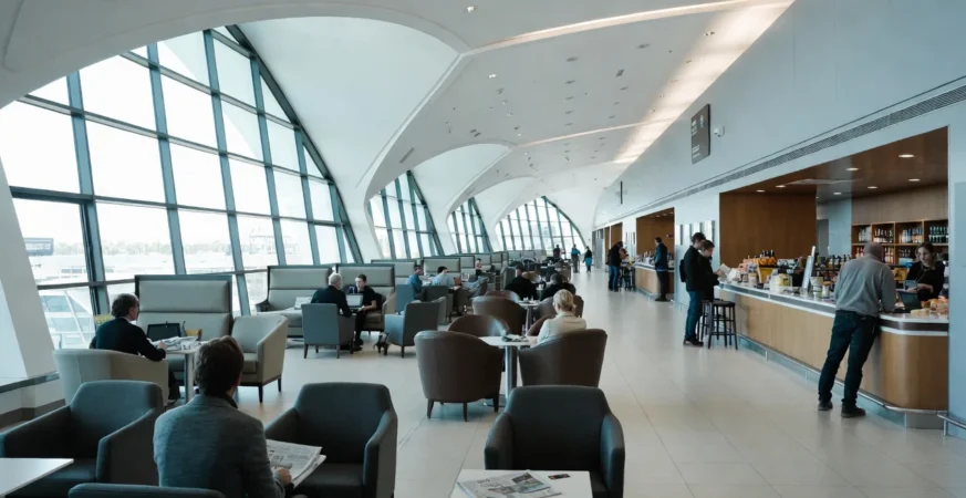 UK airport lounge with passengers using amenities and credit card displayed